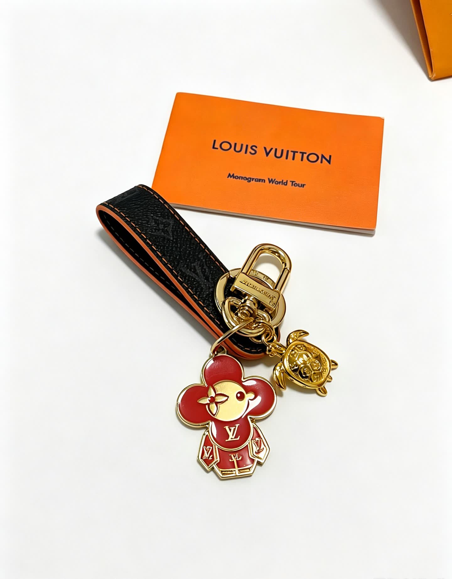 Louis Vuitton Leather Keychain with Flower and Turtle Charm